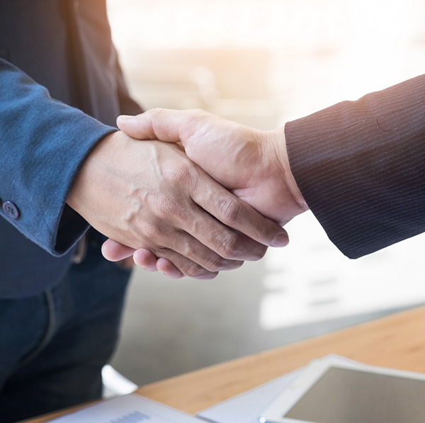 Travel management operations shaking hands